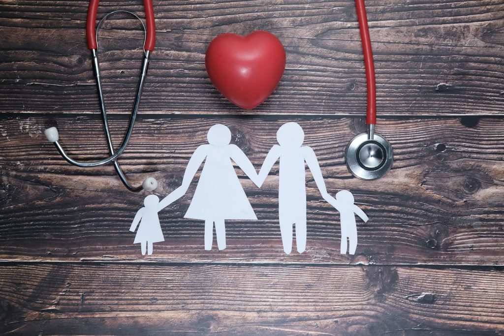 Paper cutout of family.