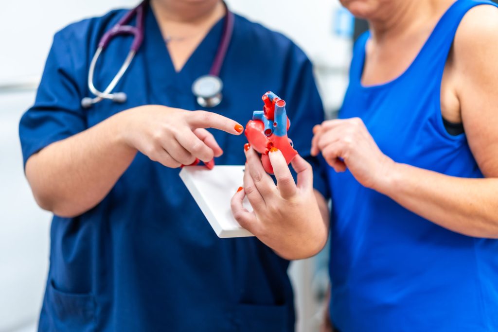 Doctor talking a patient about heart and cardiovascular health.