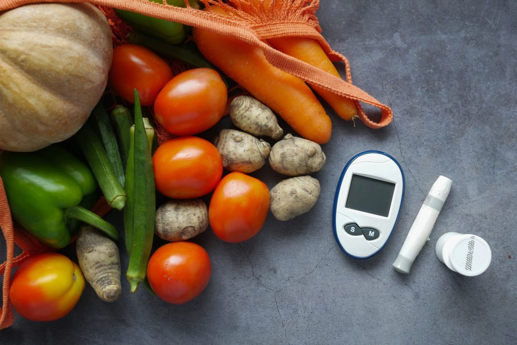 Tools and fruits concept for managing diabetes.