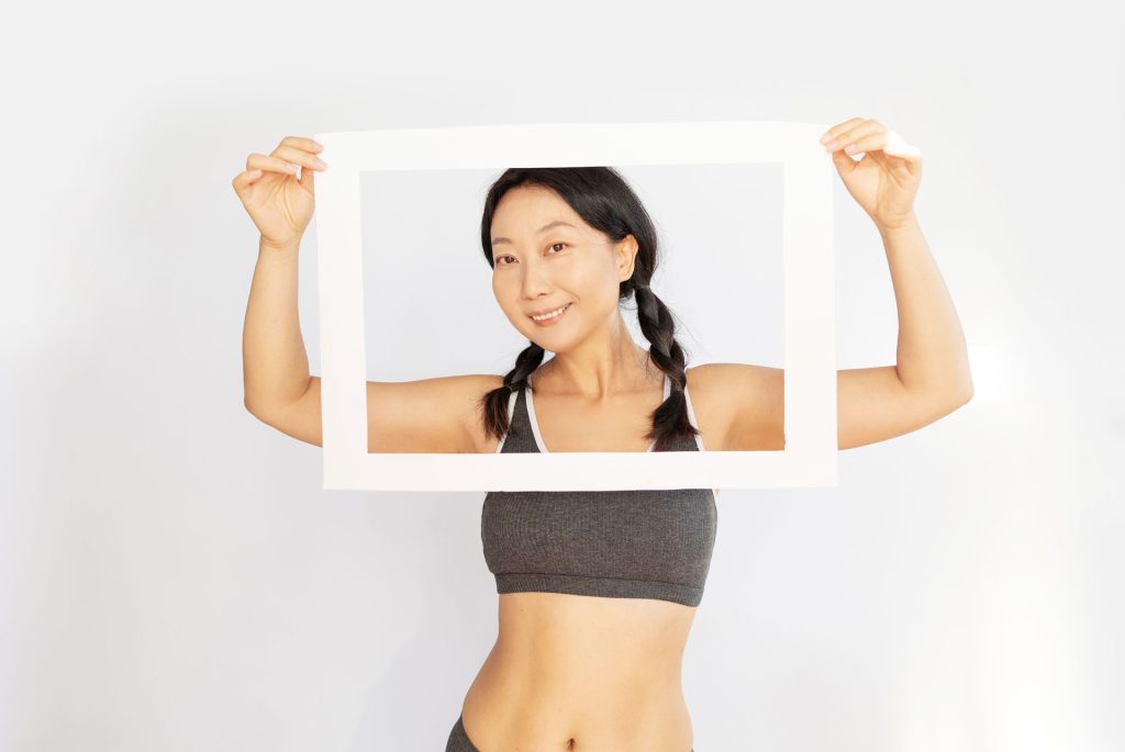 Woman holding a frame.