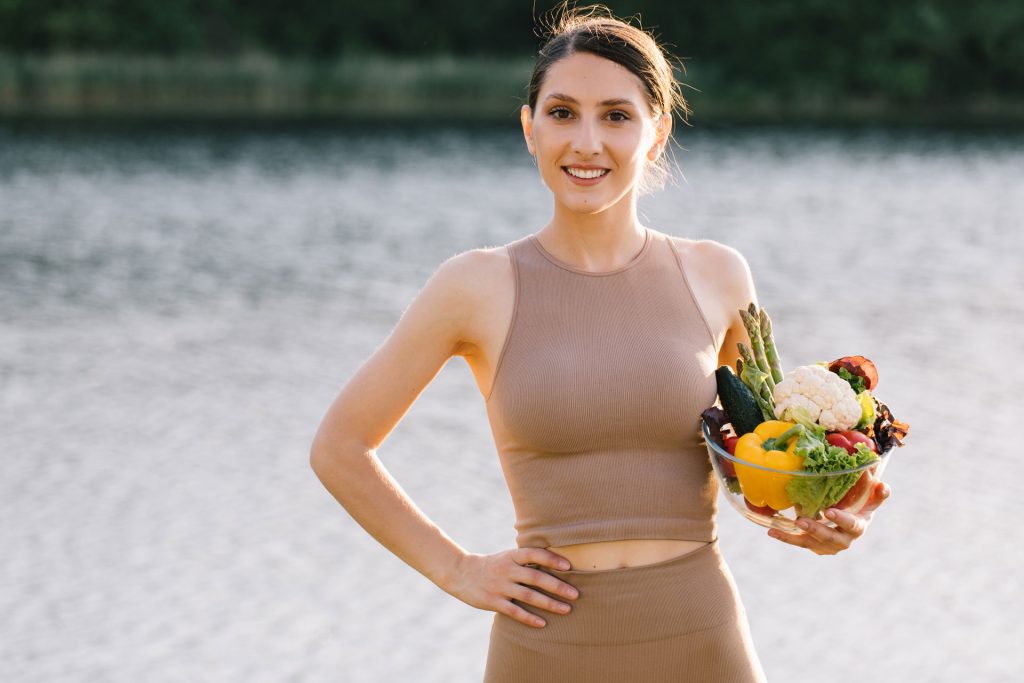 Woman holding healthy foods.