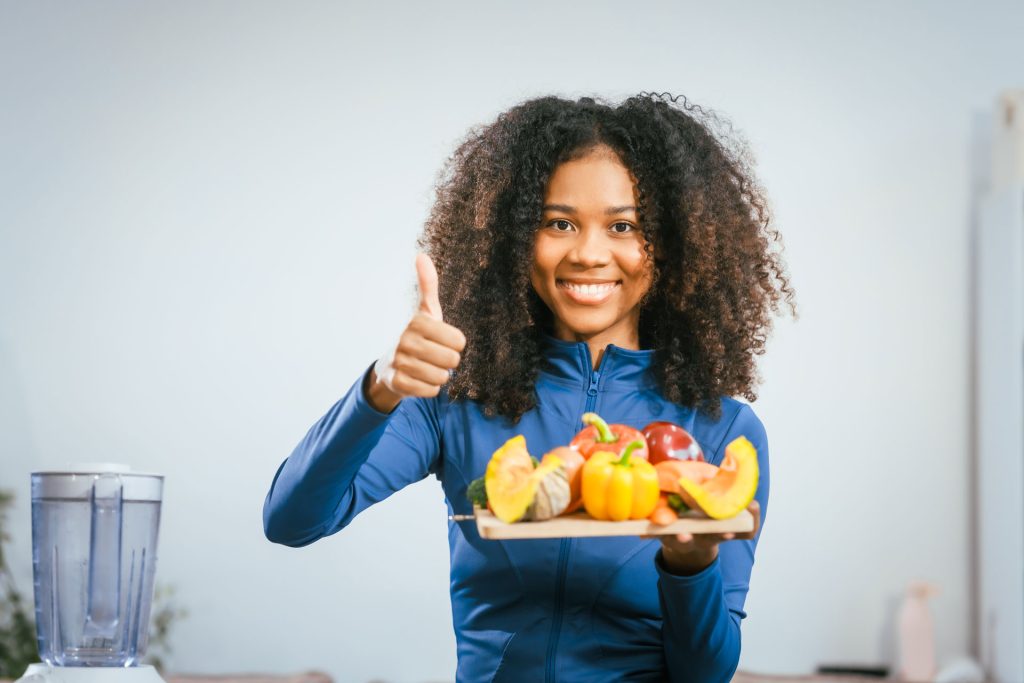Woman holding foods that naturally boost immune system.