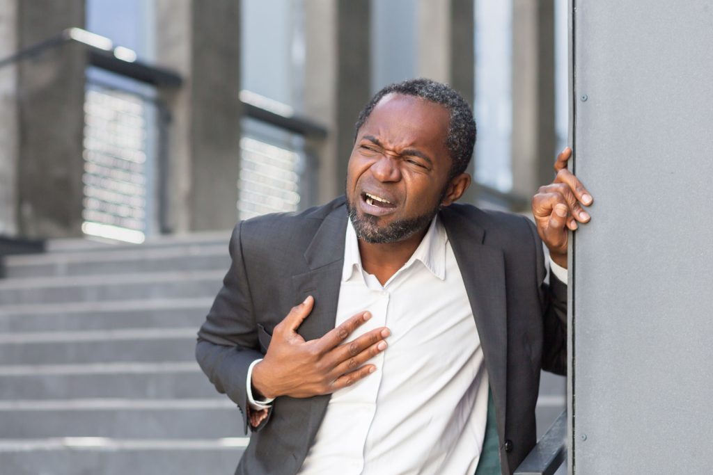 Man outside office having chest pain.