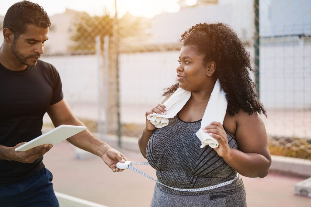Woman with her personal trainer.