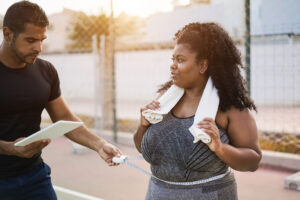 Woman with her personal trainer.