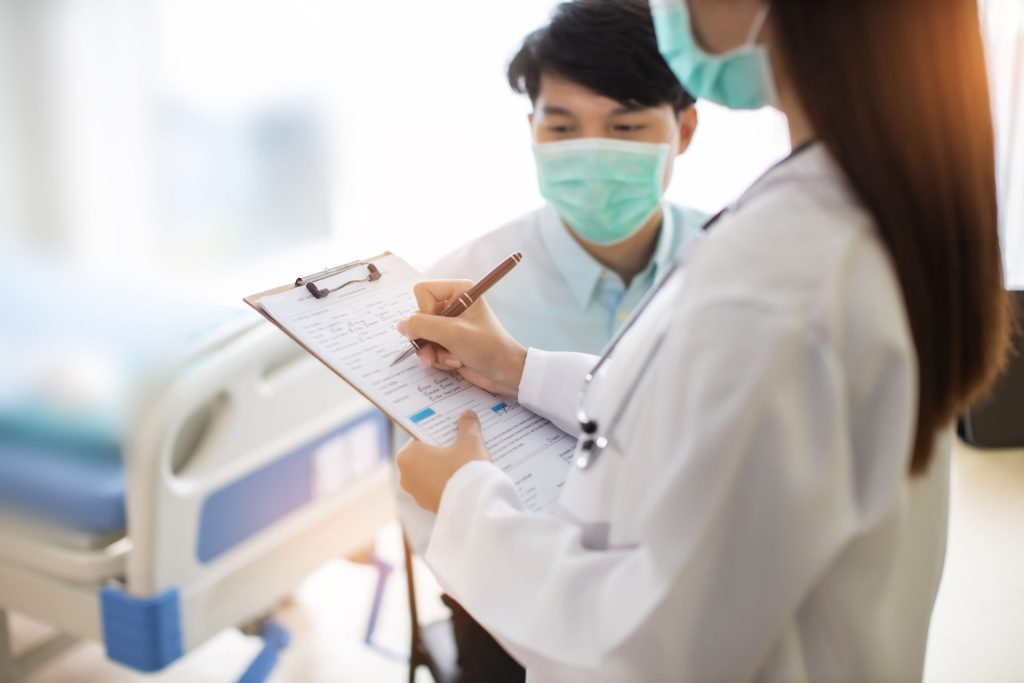 Healthcare doctor writing.