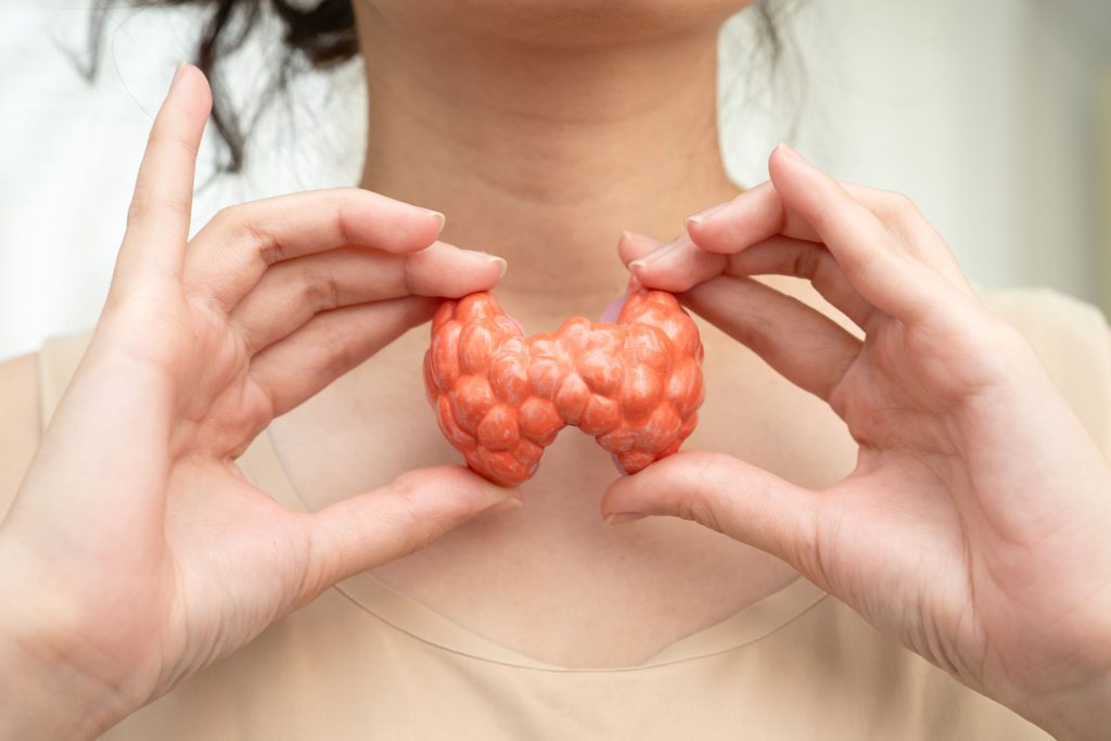 Hyperthyroidism model in woman neck.