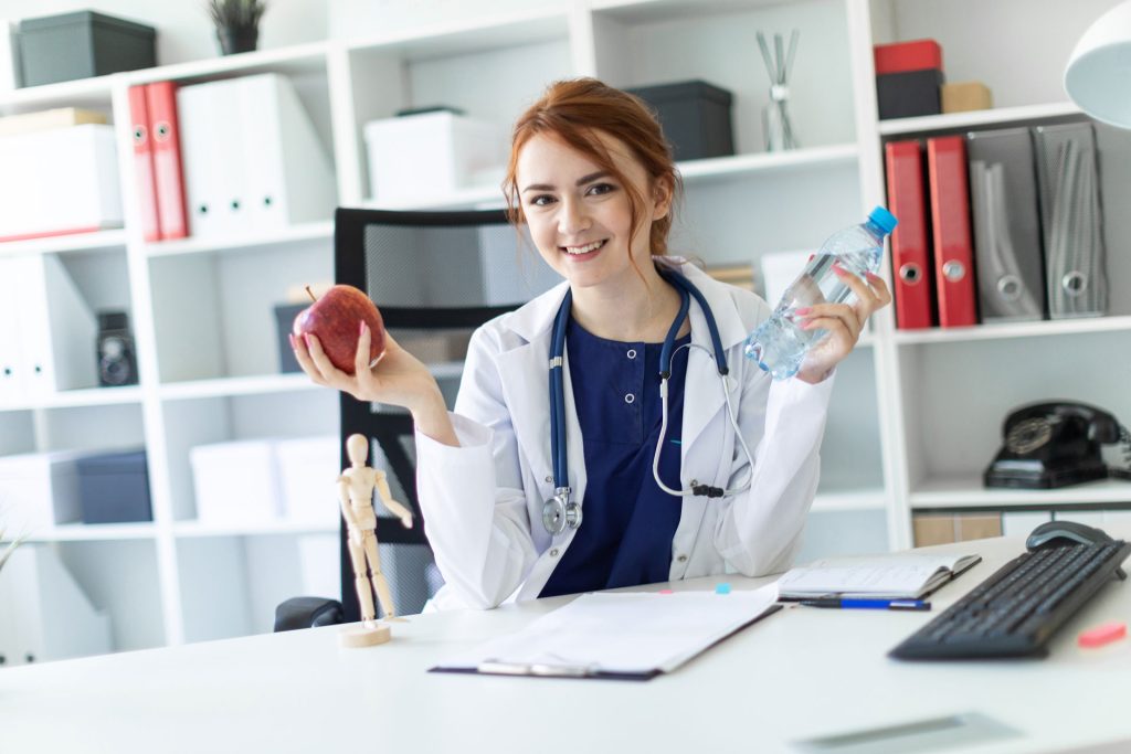 Young doctor sitting in a clinic.