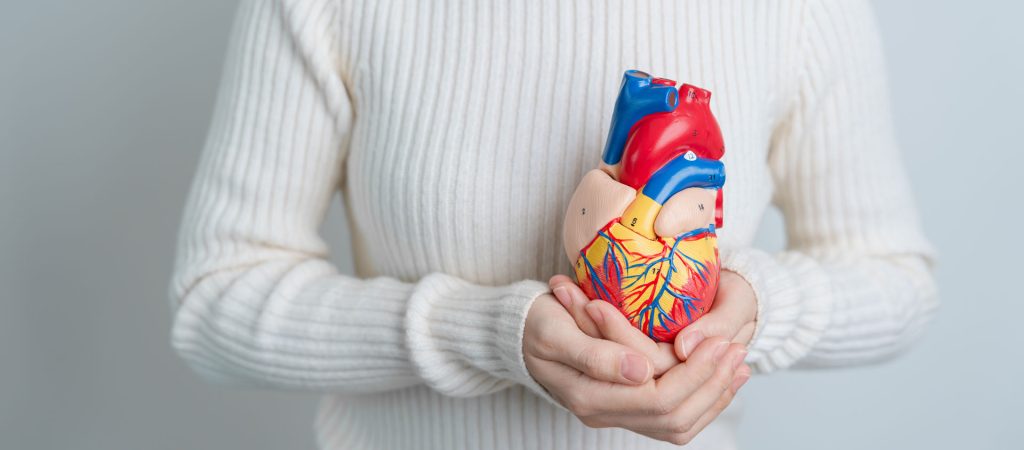 Woman holding a heart.