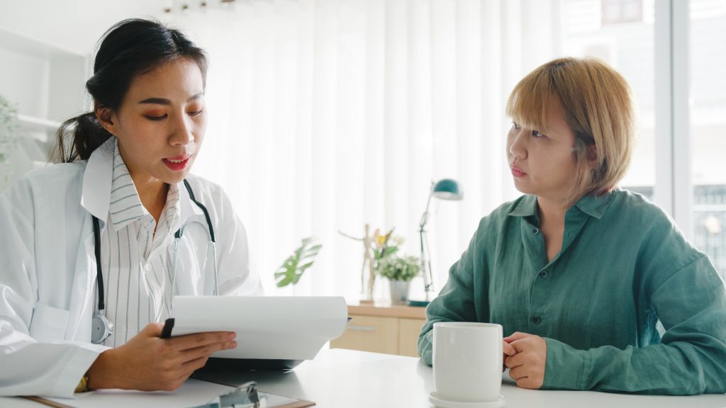 Primary care provider talking to patient.