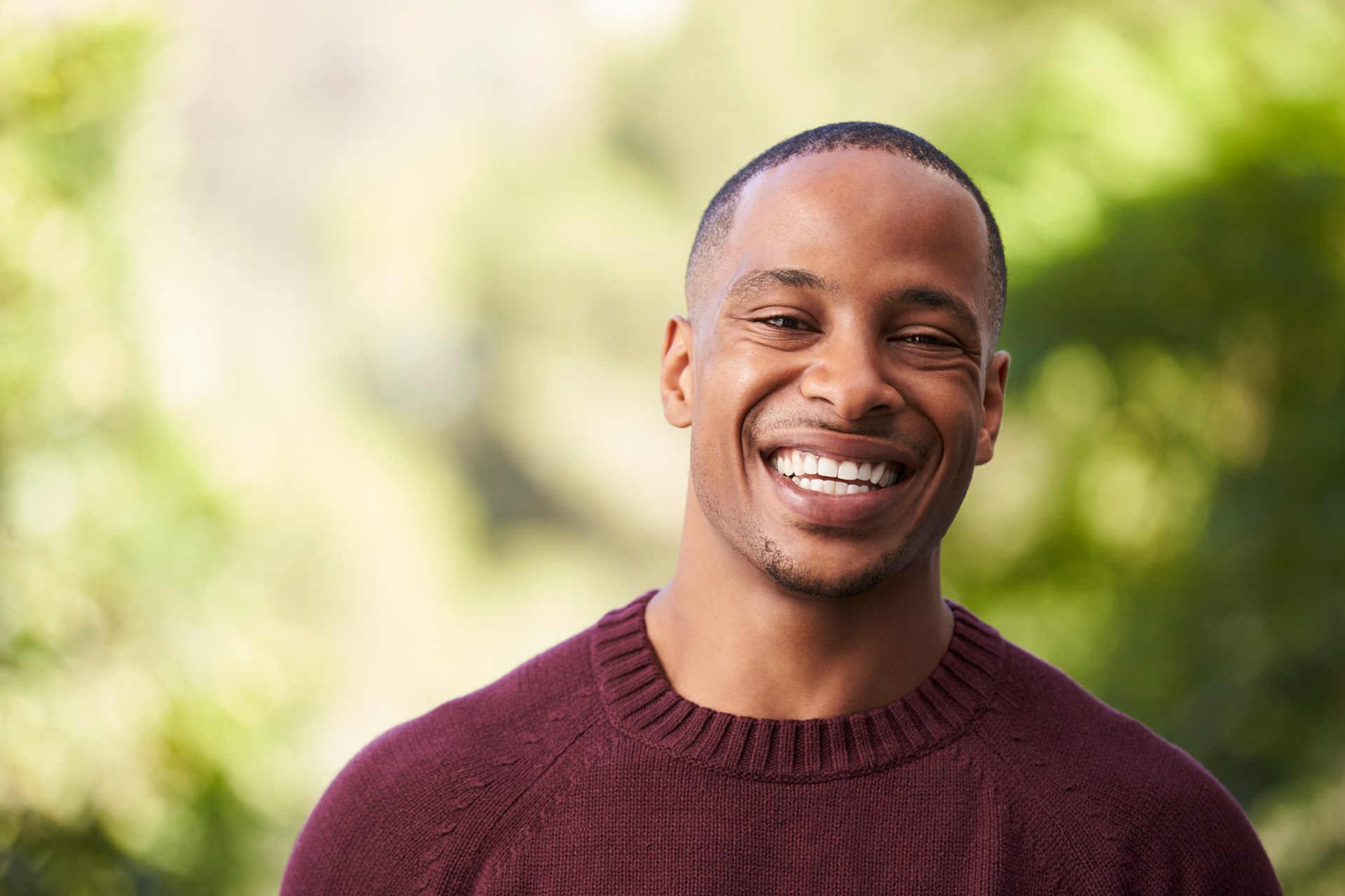 Happy man smiling outdoor.